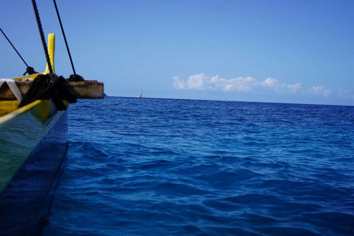 a small boat in a body of water